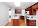 Spacious kitchen with dark cabinets, white countertops, and an island for extra prep space at 3040 Azalea Dr, Indian Land, SC 29707