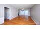 Spacious living room with hardwood floors, a ceiling fan, and a sliding glass door at 3040 Azalea Dr, Indian Land, SC 29707
