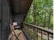 Cozy balcony with views of lush green trees and walking path at 3232 Johnny Cake Ln, Charlotte, NC 28226