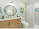 Bathroom with a granite countertop, wood cabinets, and a framed mirror at 3232 Johnny Cake Ln, Charlotte, NC 28226