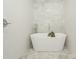 Bathroom with a modern soaking tub and white tile at 3232 Johnny Cake Ln, Charlotte, NC 28226