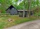 Charming black two-story home with landscaped yard and mature trees at 3232 Johnny Cake Ln, Charlotte, NC 28226