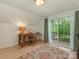 Bright home office with balcony, hardwood floors, and natural light at 3232 Johnny Cake Ln, Charlotte, NC 28226