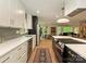 Modern kitchen featuring white cabinets, quartz countertops, stainless steel appliances, and hardwood floors at 3232 Johnny Cake Ln, Charlotte, NC 28226