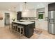 Stylish kitchen with an island, white cabinets, and modern appliances at 3232 Johnny Cake Ln, Charlotte, NC 28226