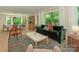 Bright, open living area with stylish decor, hardwood floors and natural light at 3232 Johnny Cake Ln, Charlotte, NC 28226