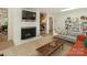 Living room featuring a fireplace and built-in bookshelves at 3232 Johnny Cake Ln, Charlotte, NC 28226