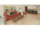 Cozy living room with hardwood floors open to kitchen with breakfast bar at 3232 Johnny Cake Ln, Charlotte, NC 28226