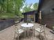 Outdoor patio with seating and views of lush landscape and home exterior at 3232 Johnny Cake Ln, Charlotte, NC 28226