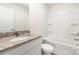 Bright bathroom with granite countertops, white cabinets, and a shower-tub combo at 3340 Burberry Dr, Gastonia, NC 28052