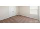 A cozy bedroom features double closet doors and a view from its side window at 3340 Burberry Dr, Gastonia, NC 28052