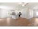 Open-concept kitchen with white cabinets, stainless steel appliances, and an island at 3340 Burberry Dr, Gastonia, NC 28052
