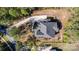 Overhead view of a beautiful home with a well-maintained gray roof and a paved driveway nestled in a serene landscape at 4237 Island Fox Ln, Denver, NC 28037