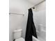 Bathroom featuring a shower with curtain, a toilet, and neutral walls at 4237 Island Fox Ln, Denver, NC 28037