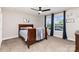 Bedroom features a ceiling fan, large windows, and neutral carpeting at 4237 Island Fox Ln, Denver, NC 28037