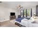 Bright bedroom with large windows, neutral tones, and comfortable furnishings at 4237 Island Fox Ln, Denver, NC 28037