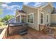 Exterior view featuring a hot tub on a wooden deck at 4237 Island Fox Ln, Denver, NC 28037