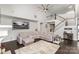 Cozy living room with a large sectional sofa and a staircase leading upstairs at 4237 Island Fox Ln, Denver, NC 28037