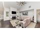 Bright living room with vaulted ceiling, fireplace, and dark hardwood floors at 4237 Island Fox Ln, Denver, NC 28037