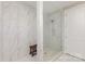 Modern shower stall with marble-look tile, glass enclosure, and built-in niche at 4237 Island Fox Ln, Denver, NC 28037