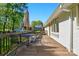 Charming back deck with an outdoor dining set and room for entertaining guests at 4307 Wrangler Sw Dr, Concord, NC 28027