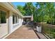 Spacious back deck with outdoor dining area perfect for entertaining and summer barbecues at 4307 Wrangler Sw Dr, Concord, NC 28027