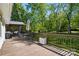 Expansive back deck with an outdoor dining area, perfect for enjoying the peaceful backyard at 4307 Wrangler Sw Dr, Concord, NC 28027