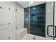 Contemporary shower featuring sleek tiles, a built-in bench, and modern fixtures for a spa-like experience at 4307 Wrangler Sw Dr, Concord, NC 28027