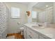 Standard bathroom with neutral tones, wood floor, and natural light at 4307 Wrangler Sw Dr, Concord, NC 28027