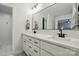 Bright bathroom featuring a large mirror above the double vanity, offering ample space and natural light at 4307 Wrangler Sw Dr, Concord, NC 28027