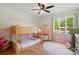 Bright bedroom featuring a bunk bed, natural light, and ceiling fan at 4307 Wrangler Sw Dr, Concord, NC 28027