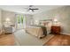 Comfortable bedroom with natural light, a ceiling fan, hardwood floors, and neutral decor at 4307 Wrangler Sw Dr, Concord, NC 28027