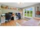 Well-lit bedroom with a study space, ample natural light, and hardwood floors at 4307 Wrangler Sw Dr, Concord, NC 28027