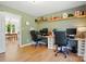 Bright bedroom with a shared desk space for study and hardwood floors at 4307 Wrangler Sw Dr, Concord, NC 28027