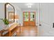 Bright entryway featuring hardwood floors and double doors leading to the outside at 4307 Wrangler Sw Dr, Concord, NC 28027
