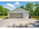 Spacious detached garage with ample parking and storage space, set on a paved driveway at 4307 Wrangler Sw Dr, Concord, NC 28027