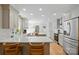Bright, open kitchen featuring an island with counter seating, stainless steel appliances, and ample cabinet space at 4307 Wrangler Sw Dr, Concord, NC 28027