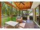 Inviting screened porch with an outdoor lounge area that provides lovely backyard views at 4307 Wrangler Sw Dr, Concord, NC 28027