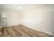 Bright bedroom with hardwood floors and ample closet space, adjacent to a full bathroom at 4921 Churchill Dr, Charlotte, NC 28269