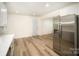 Kitchen with stainless steel refrigerator, and lots of room for an eat in area at 4921 Churchill Dr, Charlotte, NC 28269