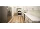 Bright kitchen showcases stainless steel appliances, light countertops, and modern wood-look floors at 4921 Churchill Dr, Charlotte, NC 28269