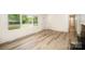 Inviting living room with new flooring and a view of the front yard at 4921 Churchill Dr, Charlotte, NC 28269