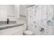 Bathroom featuring a floral shower curtain and granite countertops at 505 Tea Olive Ct, Rock Hill, SC 29732