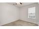 Neutral bedroom with carpet, white walls, a ceiling fan and a window for natural light at 505 Tea Olive Ct, Rock Hill, SC 29732