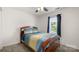 Bright bedroom with a wood bed frame, soft carpet and a large window at 505 Tea Olive Ct, Rock Hill, SC 29732