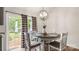 Bright breakfast room with patio door access with wood-style flooring, modern fixtures, and natural light at 505 Tea Olive Ct, Rock Hill, SC 29732