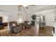 Open concept living area with vaulted ceilings, modern wood flooring, and seamless kitchen access at 505 Tea Olive Ct, Rock Hill, SC 29732