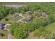 Aerial view of homes in a wooded community near a lake at 520 Steeple Chase Trl, Salisbury, NC 28144