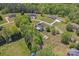 Aerial view of several homes surrounded by lush trees and greenery at 520 Steeple Chase Trl, Salisbury, NC 28144