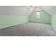 Bright bonus room with carpet, window, and fresh paint; create your perfect flex space at 520 Steeple Chase Trl, Salisbury, NC 28144